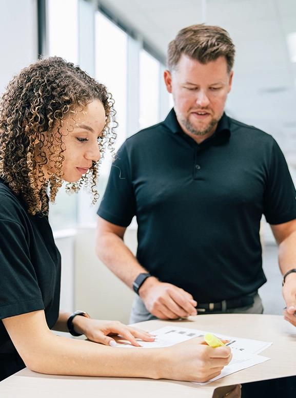 woman and man looking at forms for renting a vehicle in Duncan